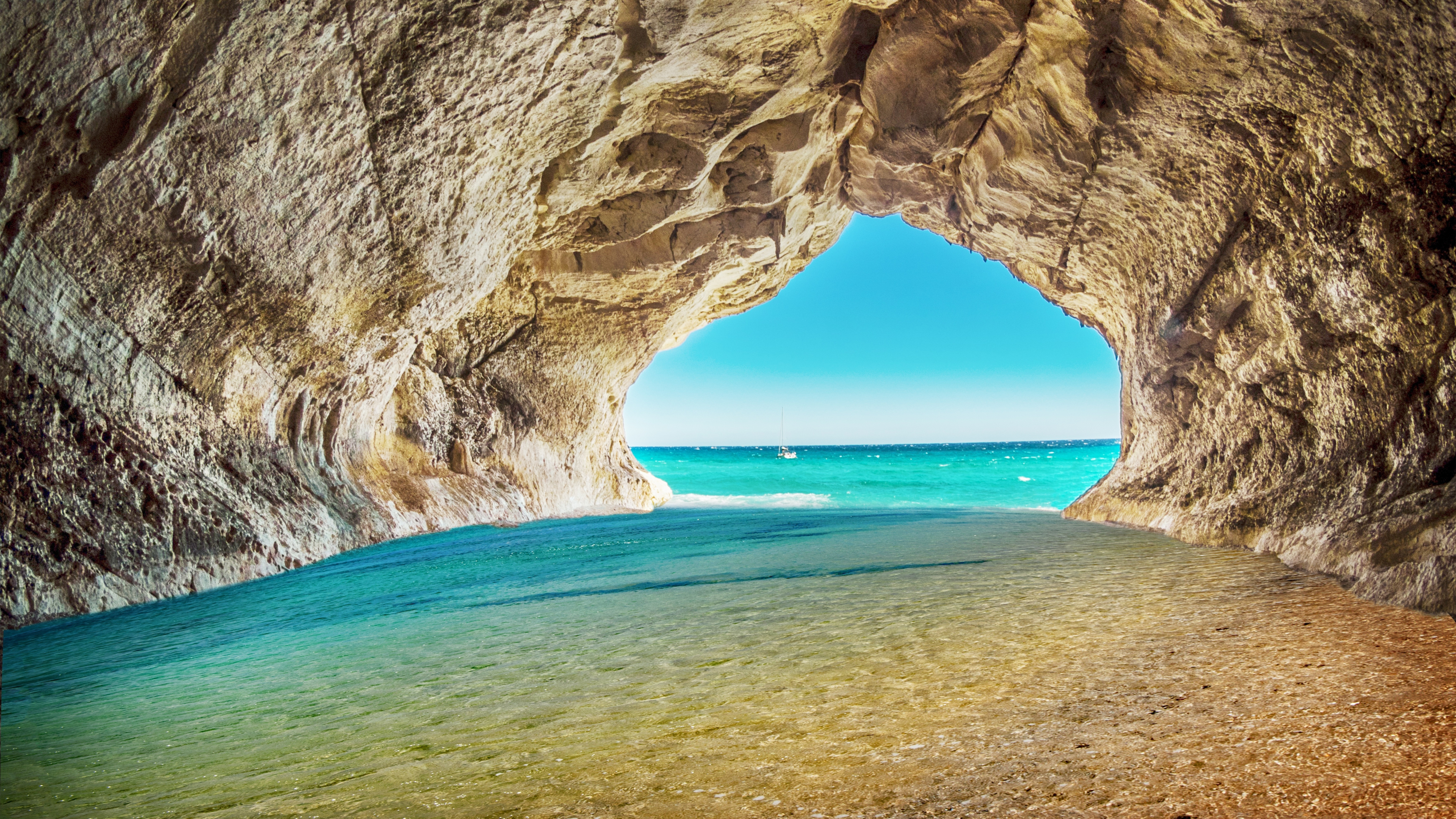 Download 5120x2880 wallpaper beach, sea, rock, arch, water, blue water, cave, 5k image, background, 19067