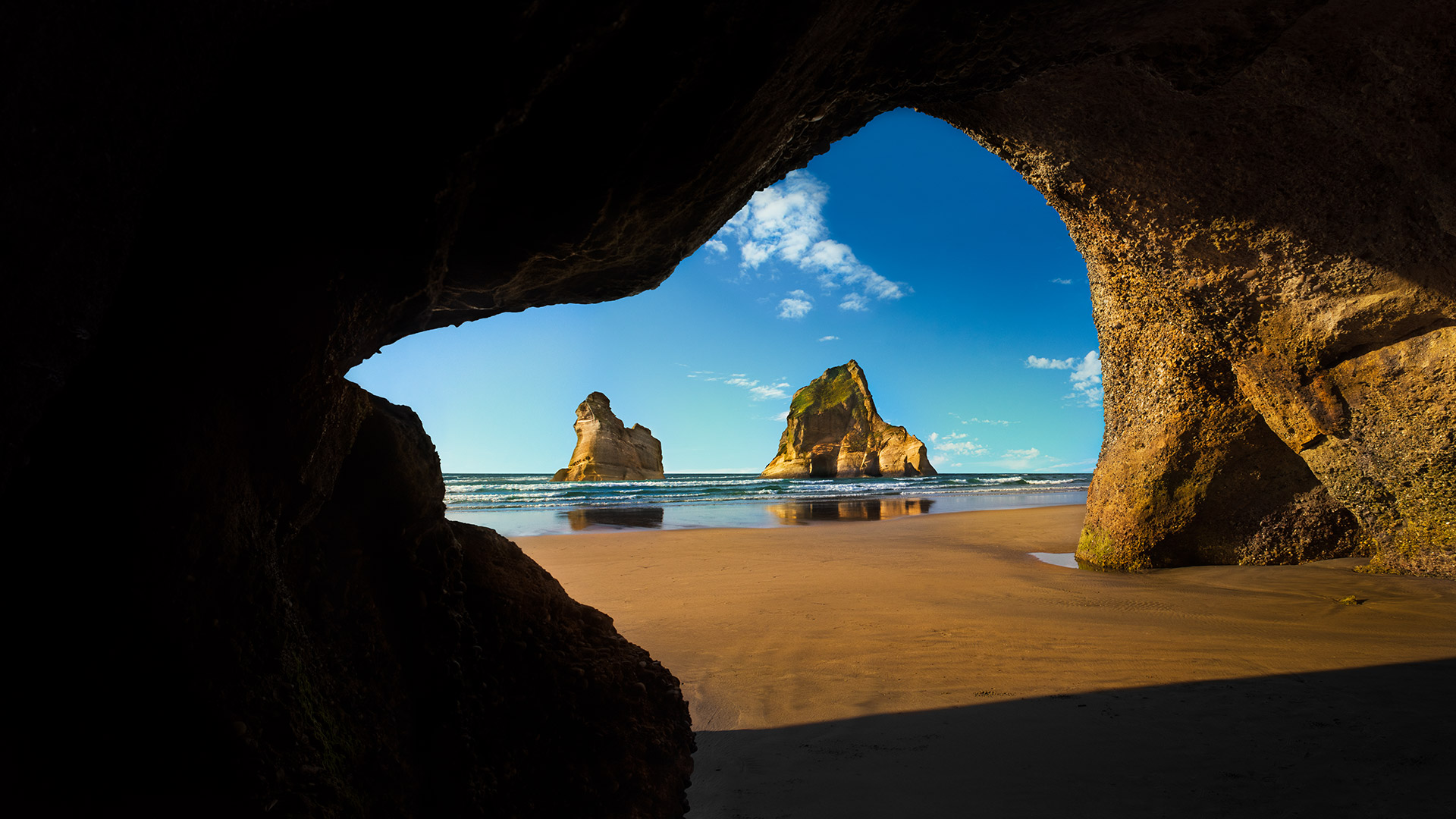 Wharariki Beach Cave, Archway Islands, South Island of New Zealand. Windows 10 Spotlight Image