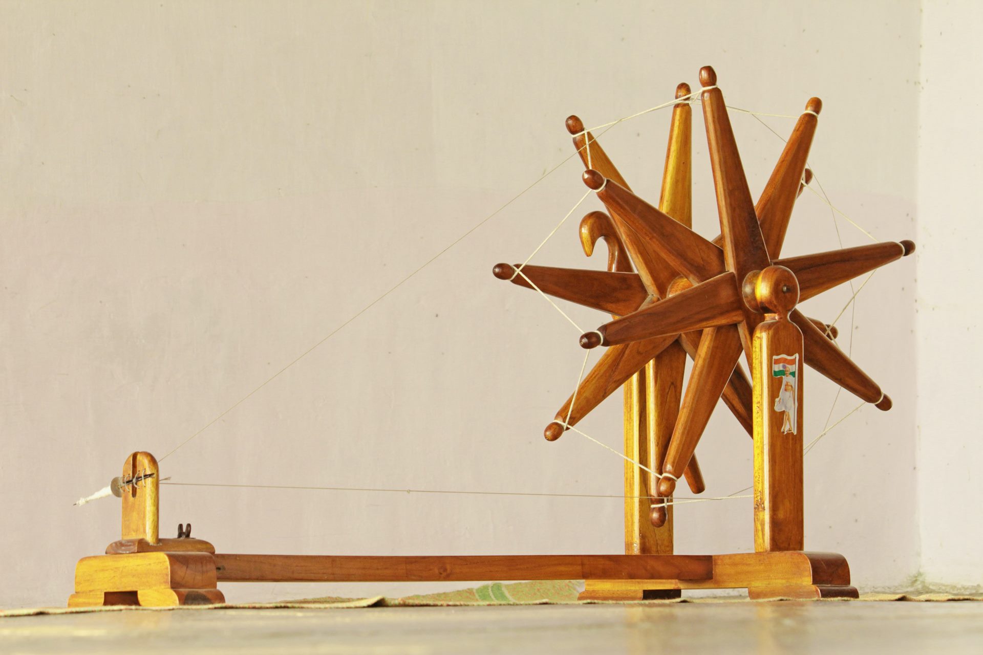 Image of CP, Delhi,India, 2020: Steel Charkha (Spinning wheel) was made  popular by Gandhi when he used it to spin his own khadi clothes.Photo shows  a giant charkha erected in CP to