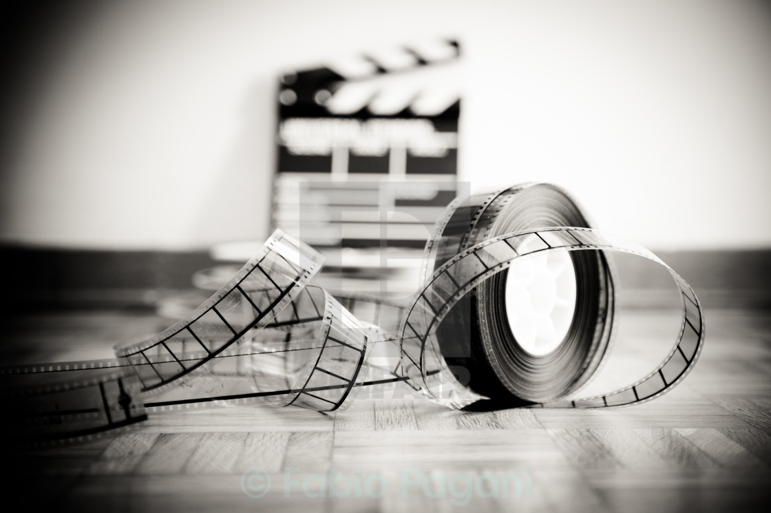 Cinema film reel and out of focus movie clapper board, download or print for £9.92