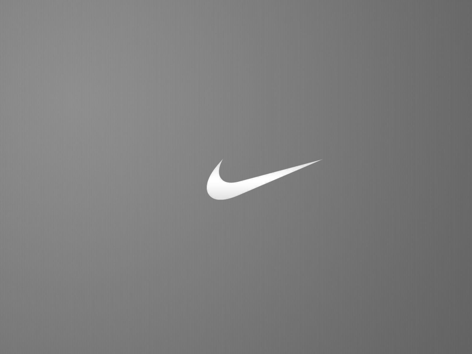 Nike logo with purple painted ribbon on black wallpaper